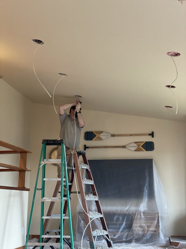 Fishing wiring through to each recessed light